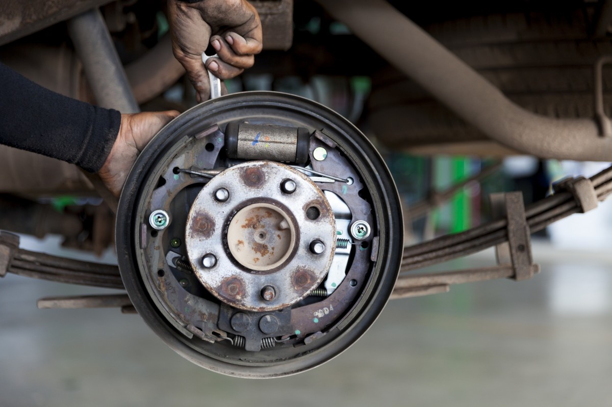 mechanic working on brakes 