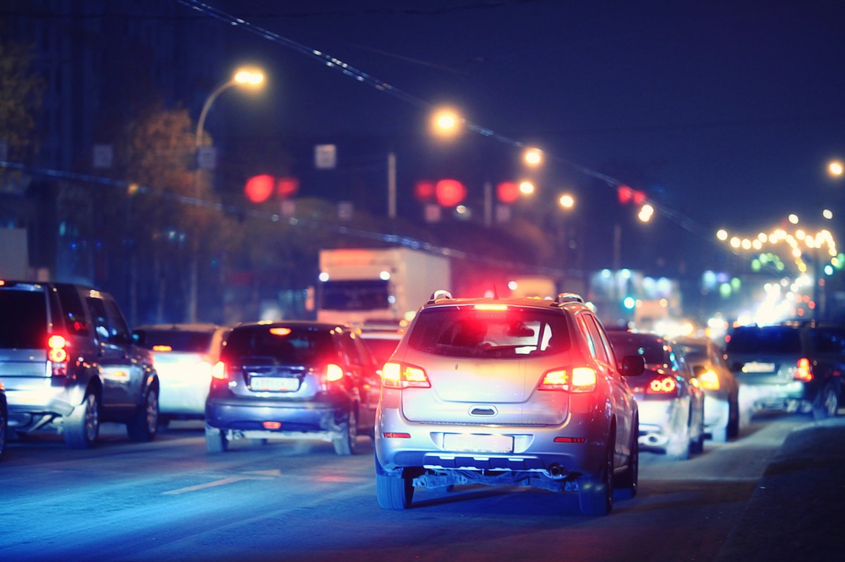 busy street with brake lights on on cars 