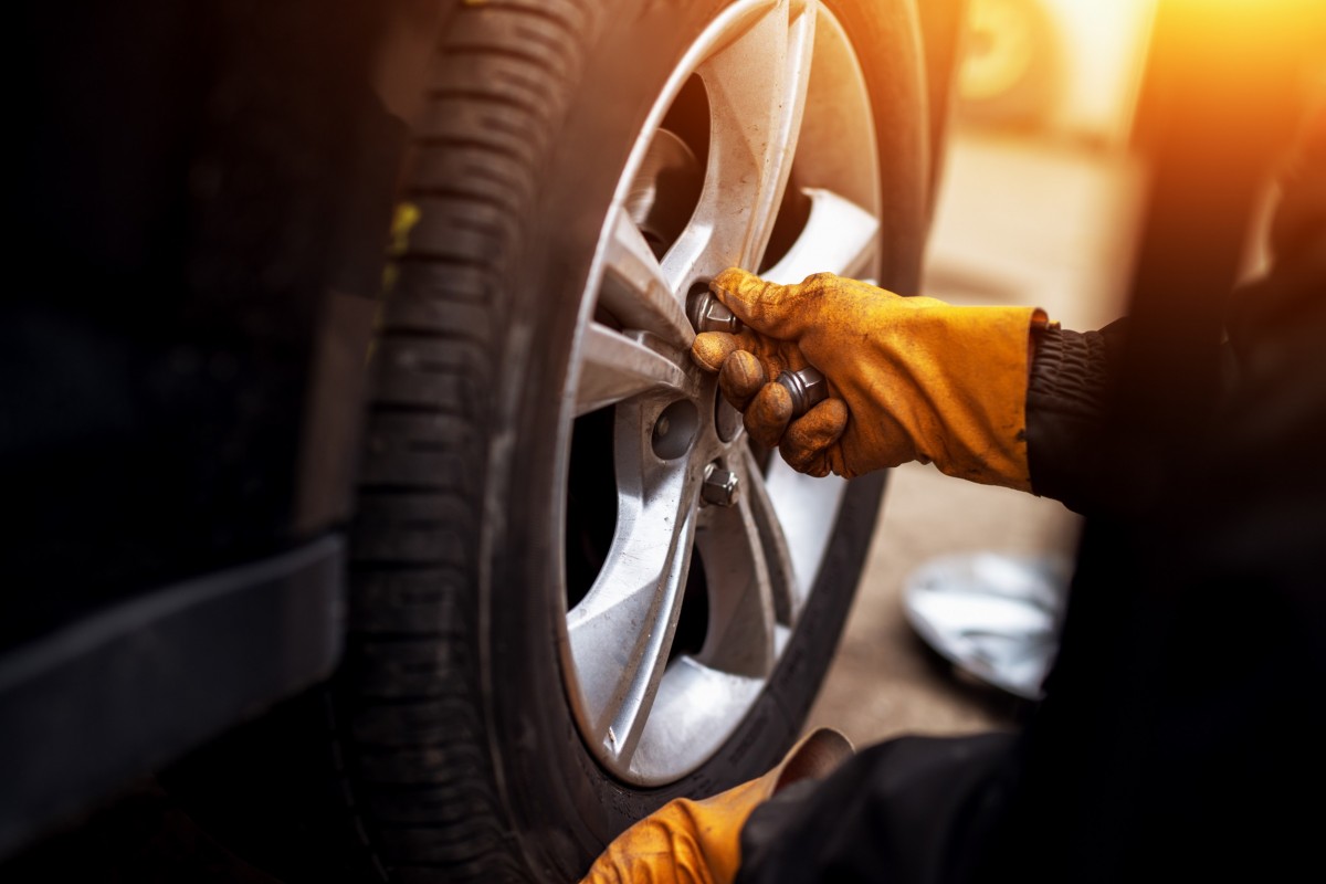 mechanic changing tire  