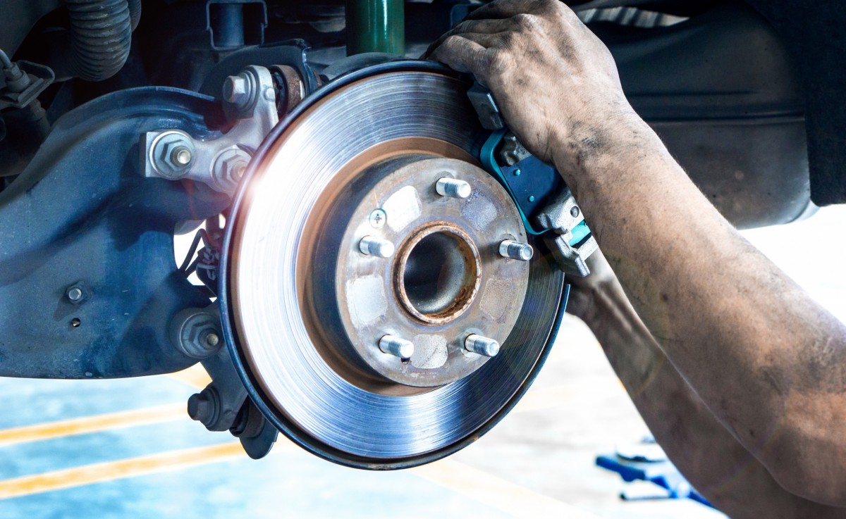 man putting on brake pads