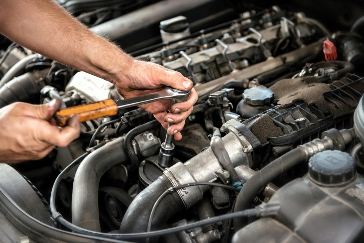 mechanic working on an engine